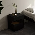 Modern Black Bedside Table With Decorative Vase Green Plant And Candles