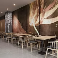 Modern Dessert Shop Interior With Red Uniform Staff Counter Tables Chairs And Green Plant Shelves