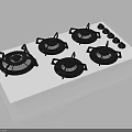 Four Burner Gas Stove With White Surface Black Burner Covers And Control Knobs