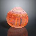 Intricate Orange Spherical Sculpture Carving With Symmetrical Patterns And Dark Background Reflection 3d model