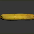 Yellow Banana With Brown Spots On Black Background And Reflected Surface