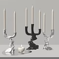 Modern Candle Holders White Black And Silver With Wavy Design And Lit Candle On Tray