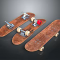 Three Wooden Skateboards With Worn Surfaces Metal Trucks And Wheels