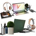 Sleek Modern Laptop Desk Setup With Wireless Headphones Books Stationery And Green Potted Plant