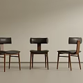 Three Modern Black Dining Chairs With Wooden Legs And Leather Seats