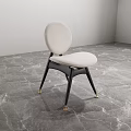 Modern Accent Chair With Round Beige Backrest Black Legs Gold Caps And Gray Marble Floor