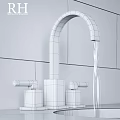 Sleek Modern Bathroom Faucet With Flowing Water And White Wall Background