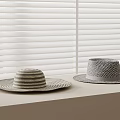 Stylish Straw Hats with Woven Patterns on Light Table Against White Blinds 3d model