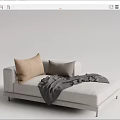 Modern Comfortable Light Toned Chaise Lounge With Beige Gray Pillows And Gray Blanket