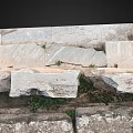 Ancient Stone Carved Architectural Elements With Intricate Floral And Geometric Motifs