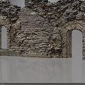 Ancient Stone Building Ruins Featuring Weathered Walls And Arched Doorways