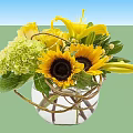 Fresh Flower Arrangement with Sunflowers Lilies and Green Hydrangeas in Glass Vase with Twisted Rattan