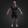 Muscular Man In Black Tight Fitting Shirt And Shorts Barefoot On Dark Background