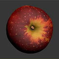 Juicy Red Apple with White Specks Yellow Top and Shiny Surface on Gray Background