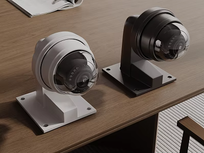 White And Black Dome Security Cameras Placed On Wooden Desk 3d model