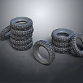 Stacked and Scattered Rubber Tires Collection on Gray Background Surface