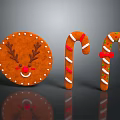 Antler Decorated Gingerbread Cookie With Smiley Face And Red White Striped Candy Canes With Icing