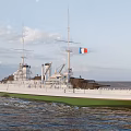 Vintage White And Green Warship Sailing At Sea With Masts Smokestacks And Gun Turrets