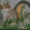 Outdoor Photo Check In Spot With Green Grass And Circular Ring Flower Decorations