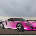 Pink Sports Car Parked By Seaside With Ocean View And Cloudy Sky
