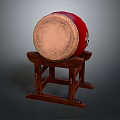 Traditional Red Musical Drum With Decorative Patterns On Leather Drumhead And Wooden Stand
