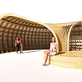 Curved Wooden Architectural Structure With Seating Area Where People Relax In Public Space