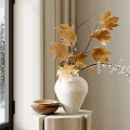 White Ceramic Vase With Yellow Maple Leaves On Cloth Covered Table By Window With Snowy Scene And Wooden Bowl