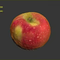 Fresh Red and Yellow Apple with White Spots and Glossy Surface on Black Background
