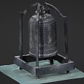 Ancient Bronze Musical Bell Stand with Intricate Patterns and Art Supplies on Green Mat