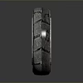 Car Tire With Silver Metallic Wheel Rim And Textured Tread Close-up View