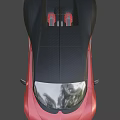 Red And Black Luxury Sports Car With Sleek Aerodynamic Design And Alloy Wheels