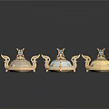 Three Ornate Winged Containers With Gold Accents And Gemstone Decorations