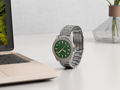 Stylish Wristwatch With Silver Metal Strap Green Dial On White Desk Beside Laptop And Vase 3d model