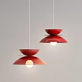 Two Red Modern Pendant Lights With Bowl Shaped Shades And Illuminated Design