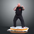Man In Black Karate Uniform Standing On Decorated Cake Platform In Martial Arts Stance