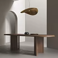 Minimalist Walnut Wooden Dining Table With Gold Hanging Lamp And Black Decor Items On Top