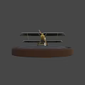 White And Yellow Model Airplane With Black Crosses On Round Gray Base