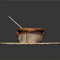 Creamy Soup in Pastry Crust Bowl on Woven Mat with Wooden Spoon