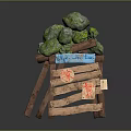 Stack of Green Stones on Wooden Crate with Blue Label Red Patterns and Small Sign