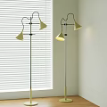 Modern Floor Lamps With Gold Brass Shades And Black Poles Near White Blinds