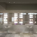 Modern Shopping Mall Retail Store With Glass Shelves Product Display And Lighting Fixtures
