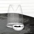 Transparent Glass Container With Funnel Top Base And Metal Bowl Of Black Pebbles
