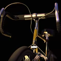 Modern Yellow Bicycle With Black Seat Handlebar And Orange Rimmed Wheels