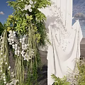 Floral Decor Installation With White Drapery Green Foliage And Hanging White Flowers For Event Backdrop