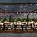 Outdoor Restaurant With Tables Chairs String Lights On Ceiling And Green Plants Around