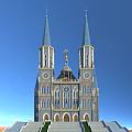 European Architecture With Twin Blue Spires Arched Windows Clocks And Dome Against Blue Sky