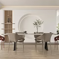 Elegant Modern Restaurant Dining Area With Round Table Chairs Decorative Wall And Potted Plants