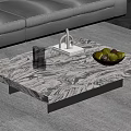 Modern Marble Coffee Table With Glass Cup Sculpture And Green Fruit Bowl In Living Room