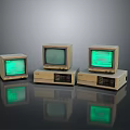 Three Vintage Computer Monitors With Green Screens On Dark Reflective Surface