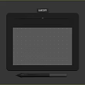 Black Wacom Digital Drawing Tablet with Dot Pattern Surface and Stylus Pen